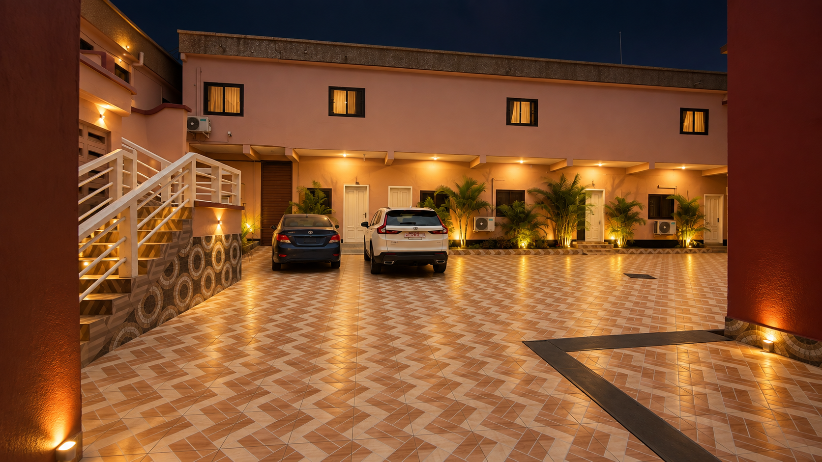 KUM Hotel courtyard car park at night with secure guest parking